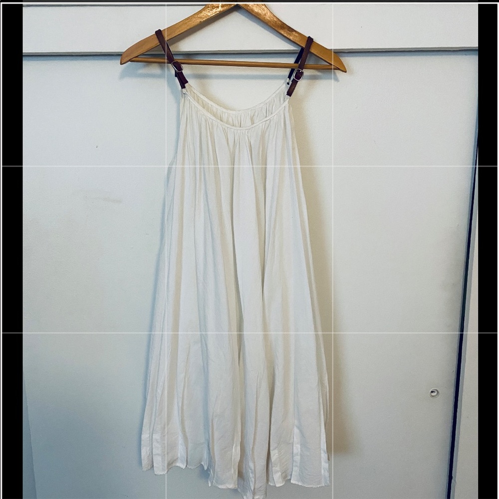 Cotton babydoll dress with vegan leather straps